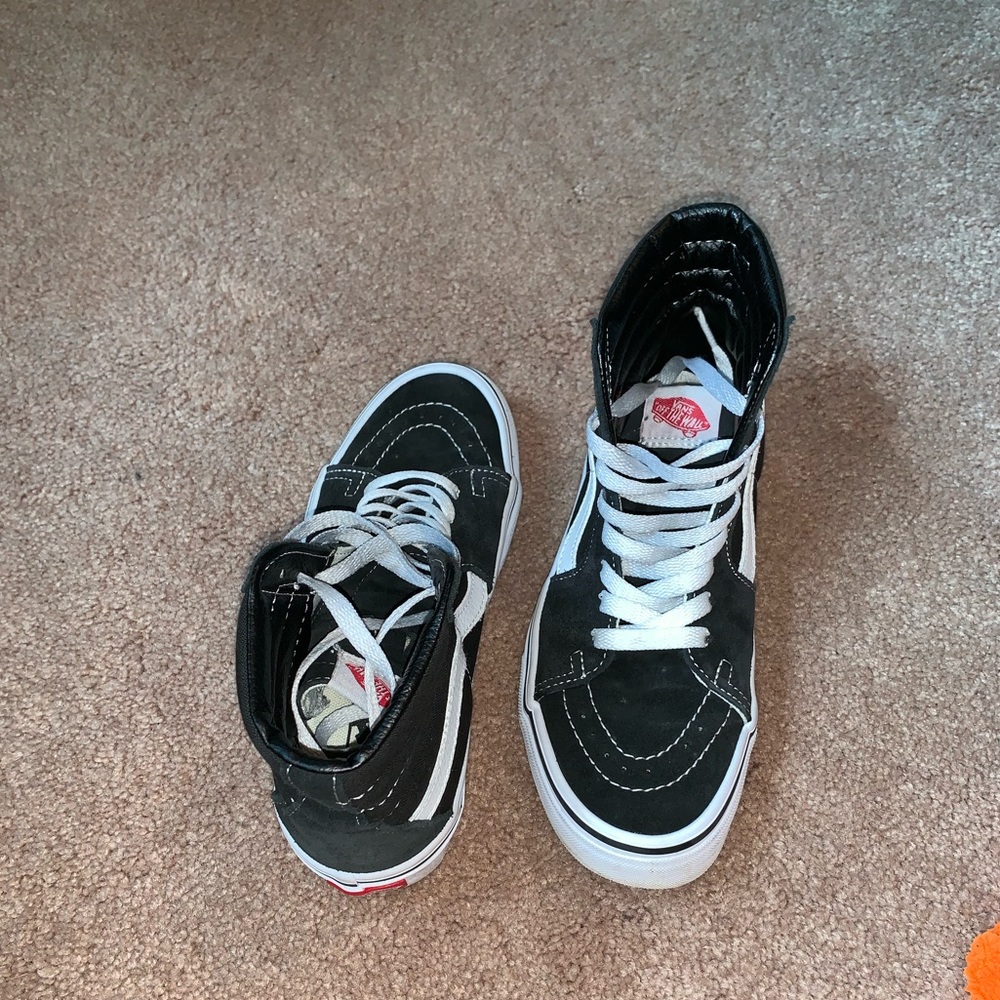 Black and white high top vans
